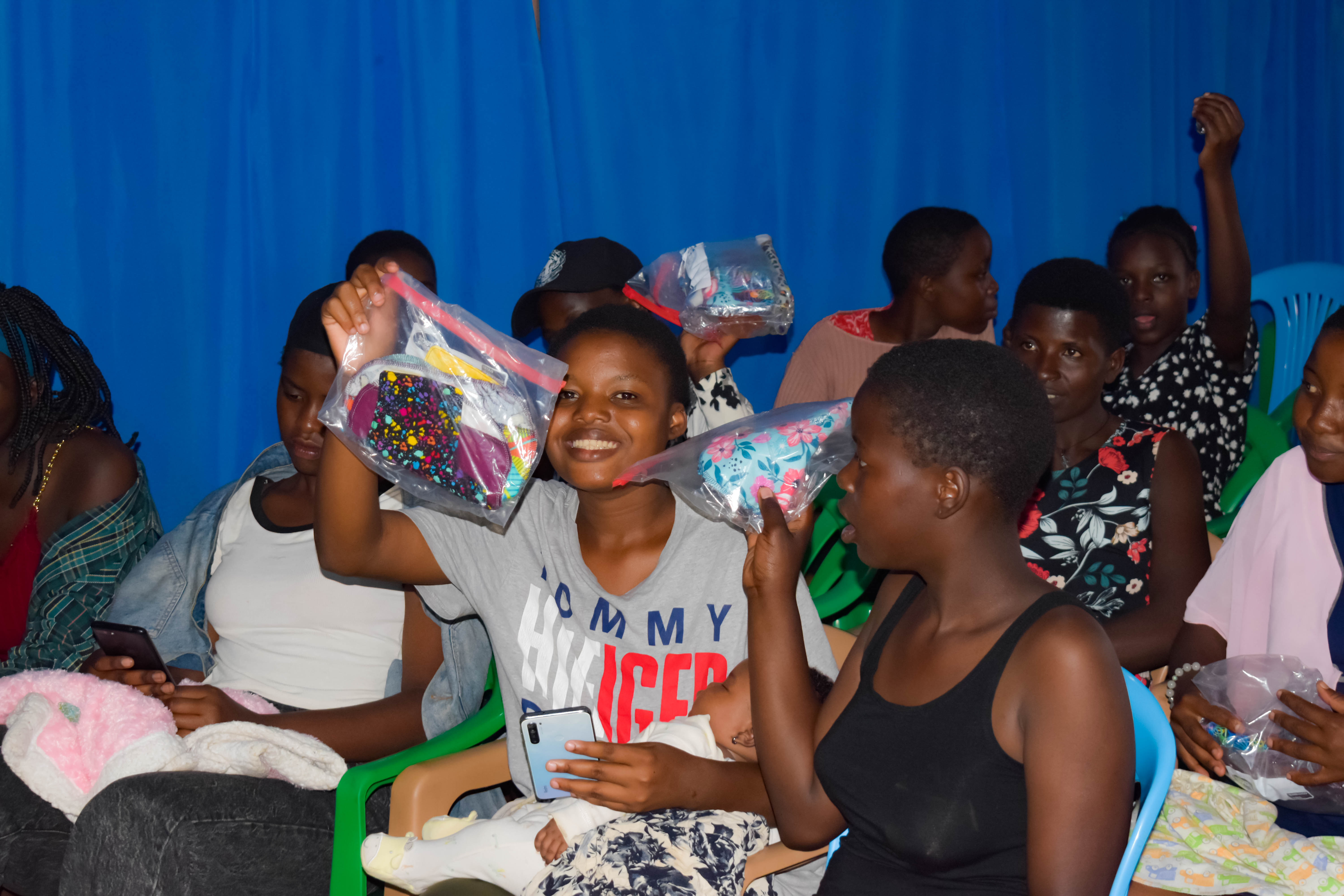 Girls holding reusable pads